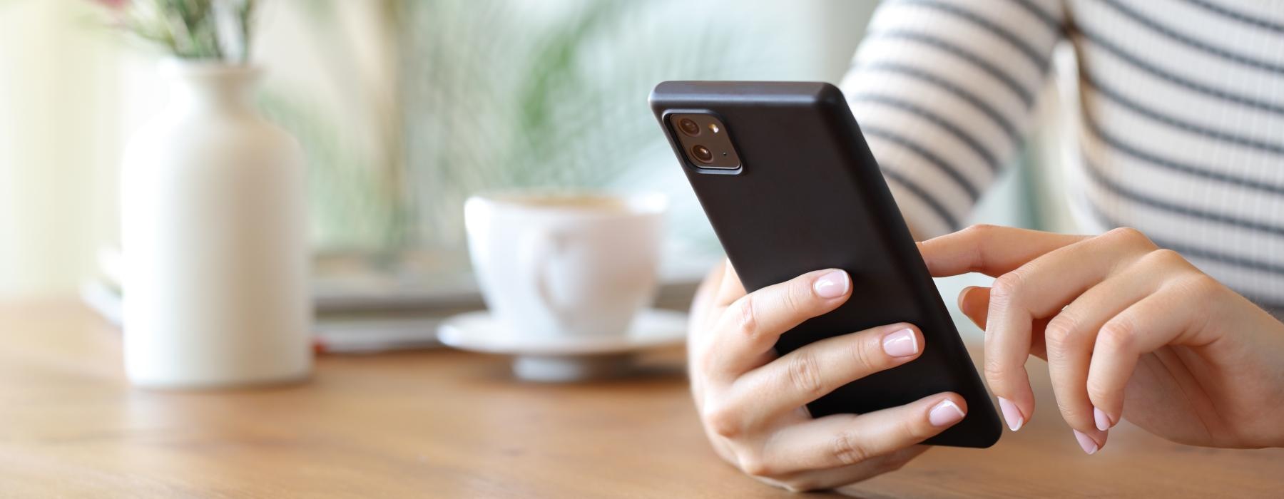 a woman holding a phone