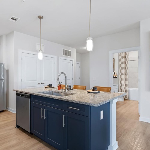 a kitchen with a large painting on the wall